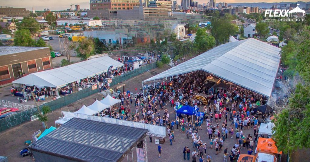 Outdoor festival with structure tents, pole tents, and canopy tents of various sizes