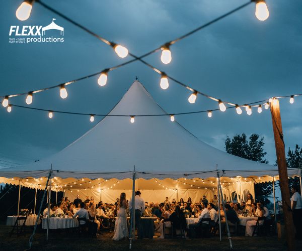 pole-tent-wedding-reception Pole tent rental and market lighting set up for an outdoor wedding reception