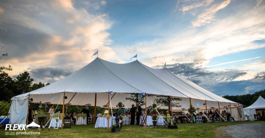Tidewater tent rental set up for an outdoor wedding under a beautiful blue sky