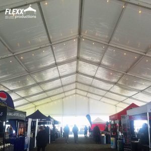 Renting an event tent like this massive structure tent provides security for vendors and merchants at large multi-day events