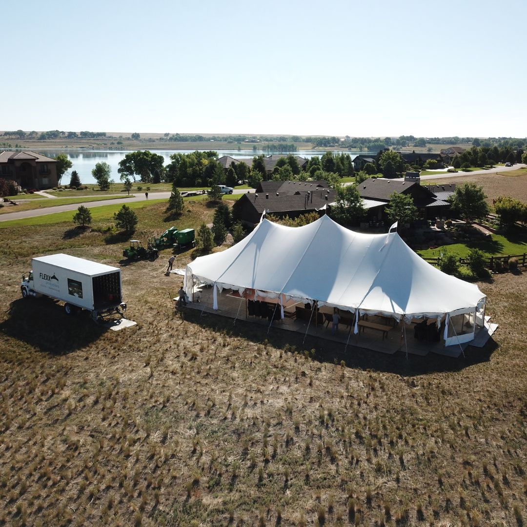 custom-cad-layout-design Large tidewater tent and a FLEXX Productions truck on a property for a lakeside wedding event