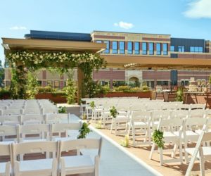 White chair rentals for an outdoor rooftop wedding