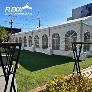 Structure tent with clear tent windows and concrete coverings