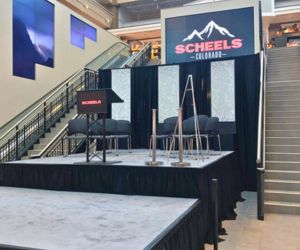 Stage rentals with pipe and drape set up for an event at Scheels