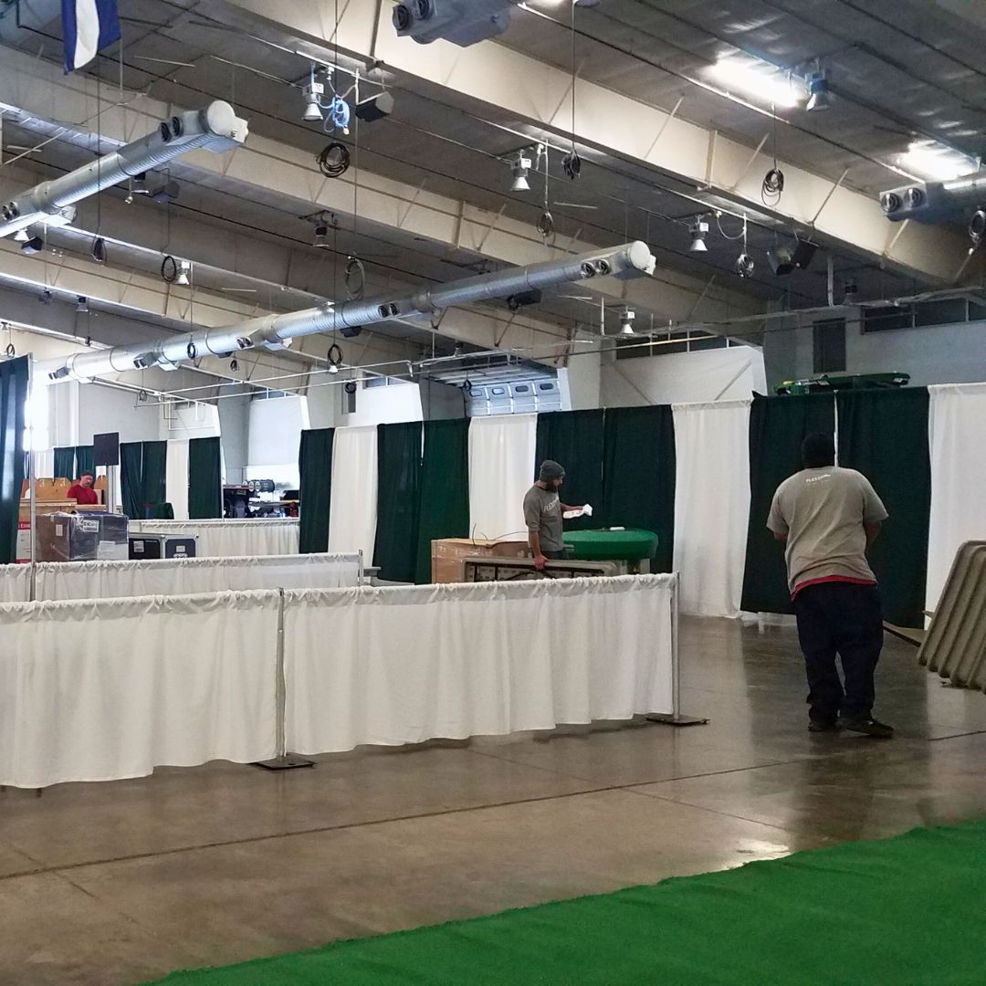 technical-assistance The FLEXX team setting up pipe and drape and other trade show rentals