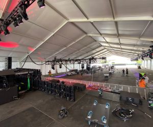 Festival lighting set up under a tent for a concert