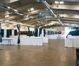 Pipe and drape rentals set up for an indoor festival