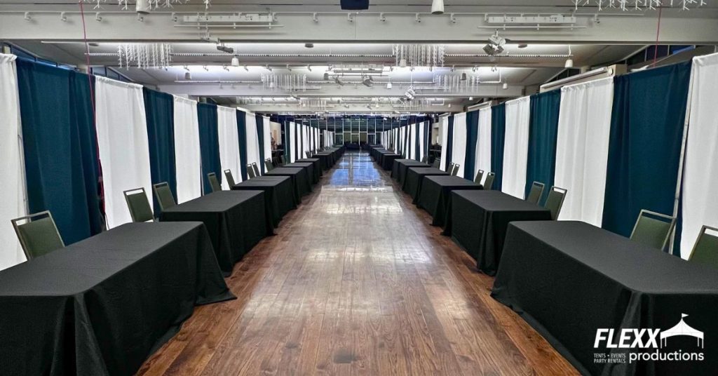 Pipe and drape rentals set up at an indoor event