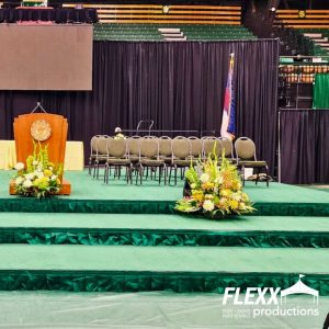 Black pipe and drape rentals set up for an event at CSU