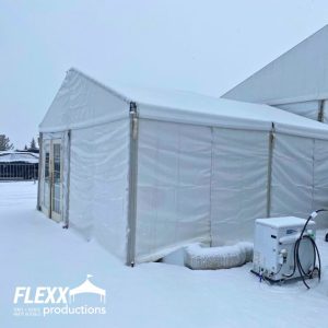 Tent covered in snow at a winter festival